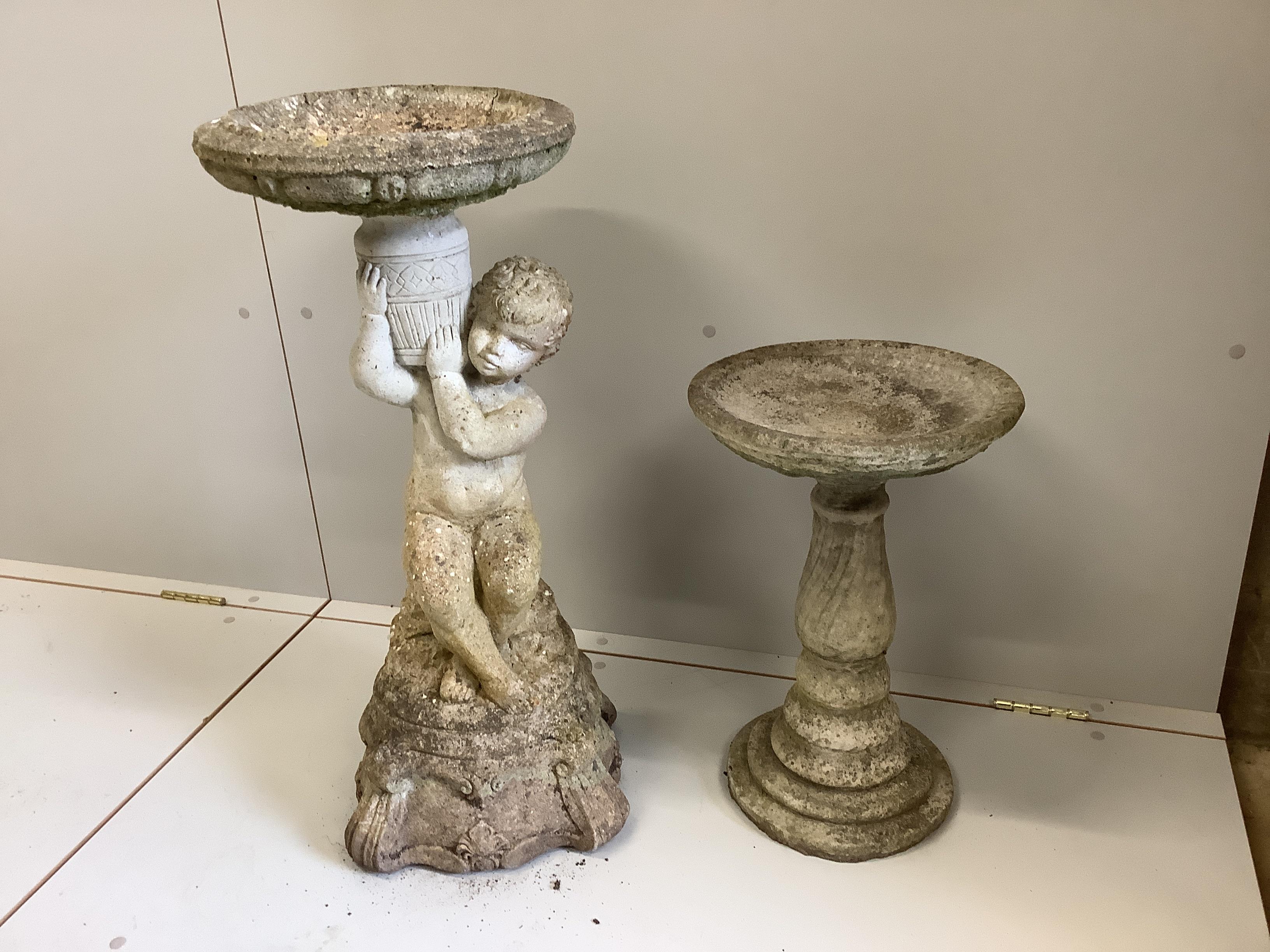 Two weathered reconstituted stone bird baths, weathered, larger height 76cm